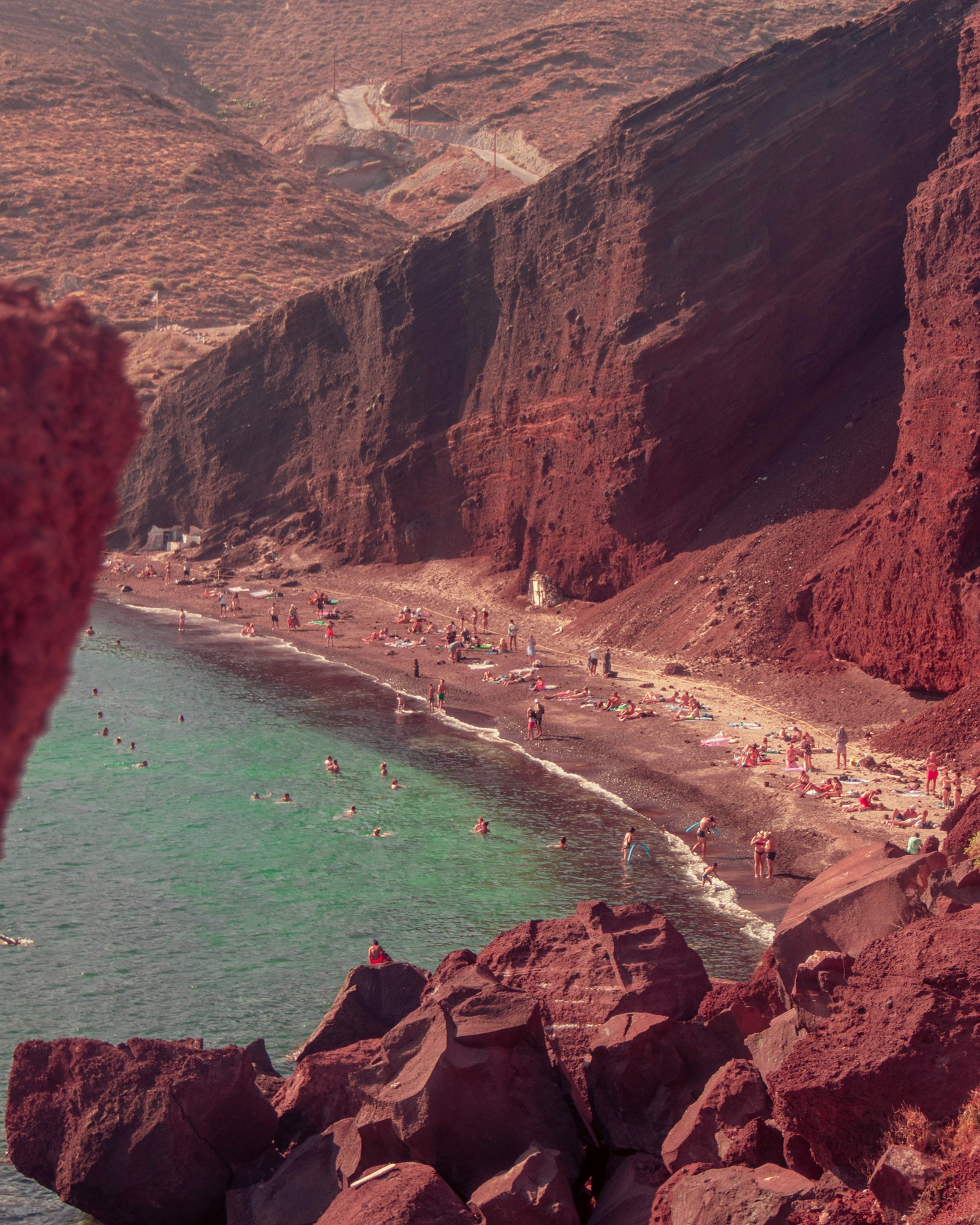 Red Beach in Santorini with volcanic red cliffs and turquoise water