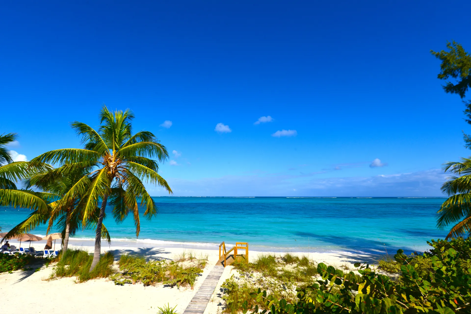 The turquoise shallows of Grace Bay Beach at golden hour